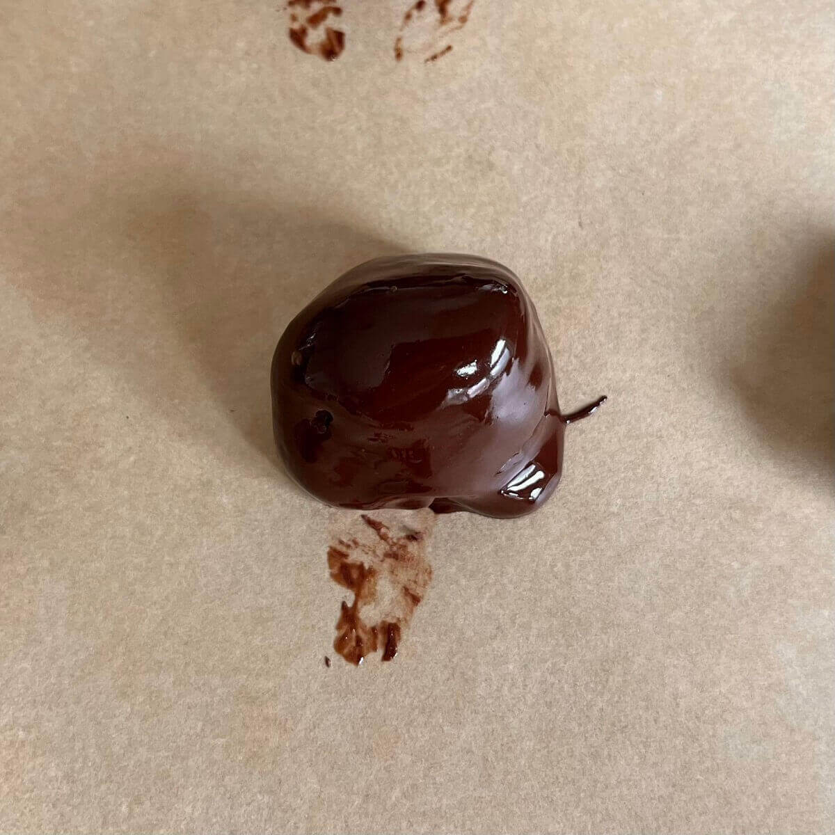 A tahini chocolate treat on a piece of parchment paper.