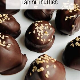 Tahini chocolates on a white plate.