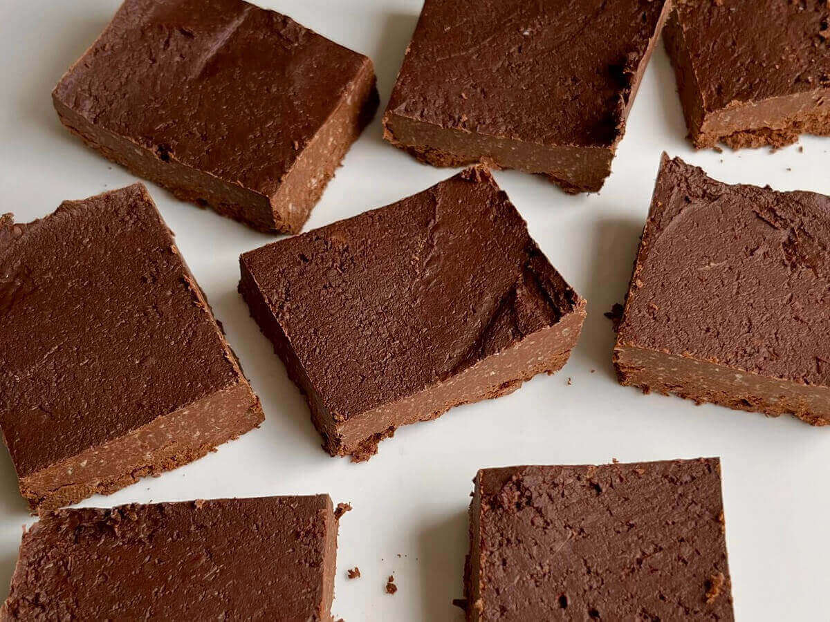 Chocolate fudge made with chickpeas cut into squares.